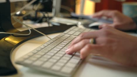 man using a computer and typing on the keyboard.