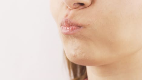 close-up portrait of woman eating chocolate. eating chocolate.