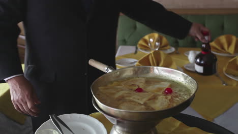 chef preparing crepe suzette