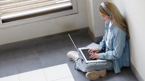two asian girls student partners are working on a laptop help study together