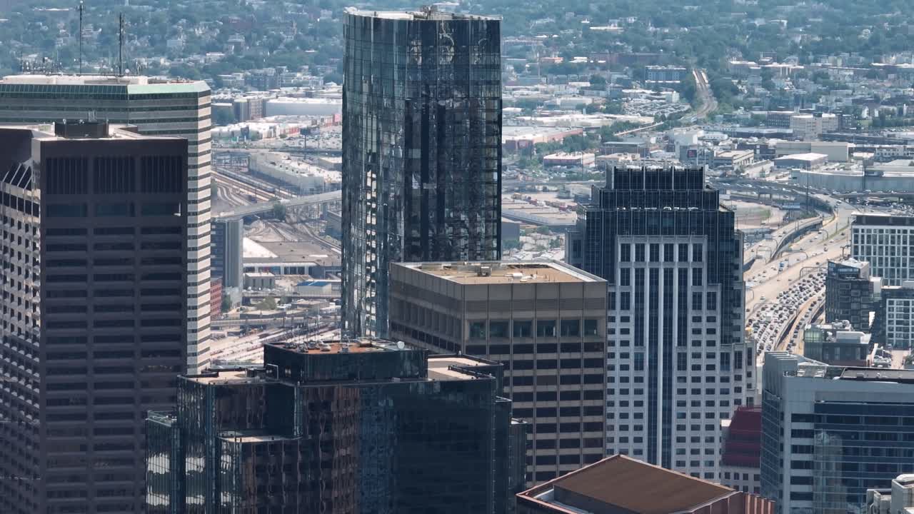 Drone shot of Boston's downtown skyscrapers on a sunny day