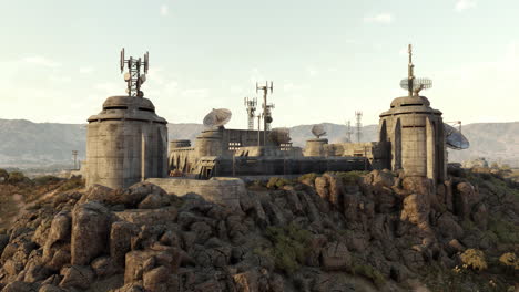 futuristic military base on a mountaintop