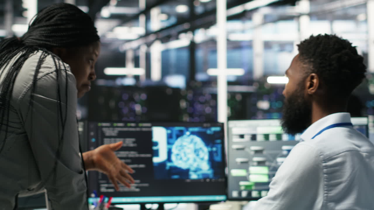 Data center supervisor overseeing work done by engineer using deep learning