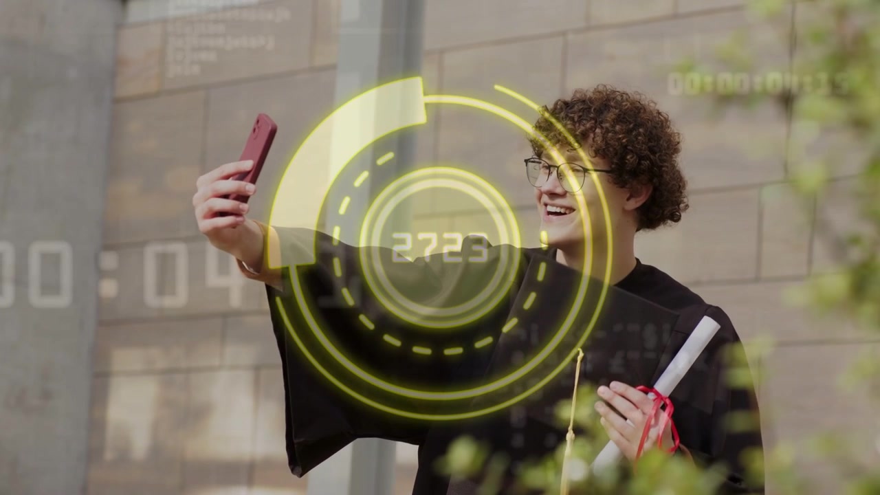 grad checking red phone framing selfie, holding diploma for grad, yellow HUD overlay around phone