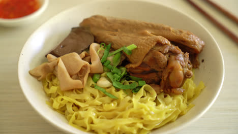 egg noodles served dry with braised duck - asian