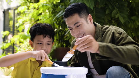 asian man and boy in the backyard