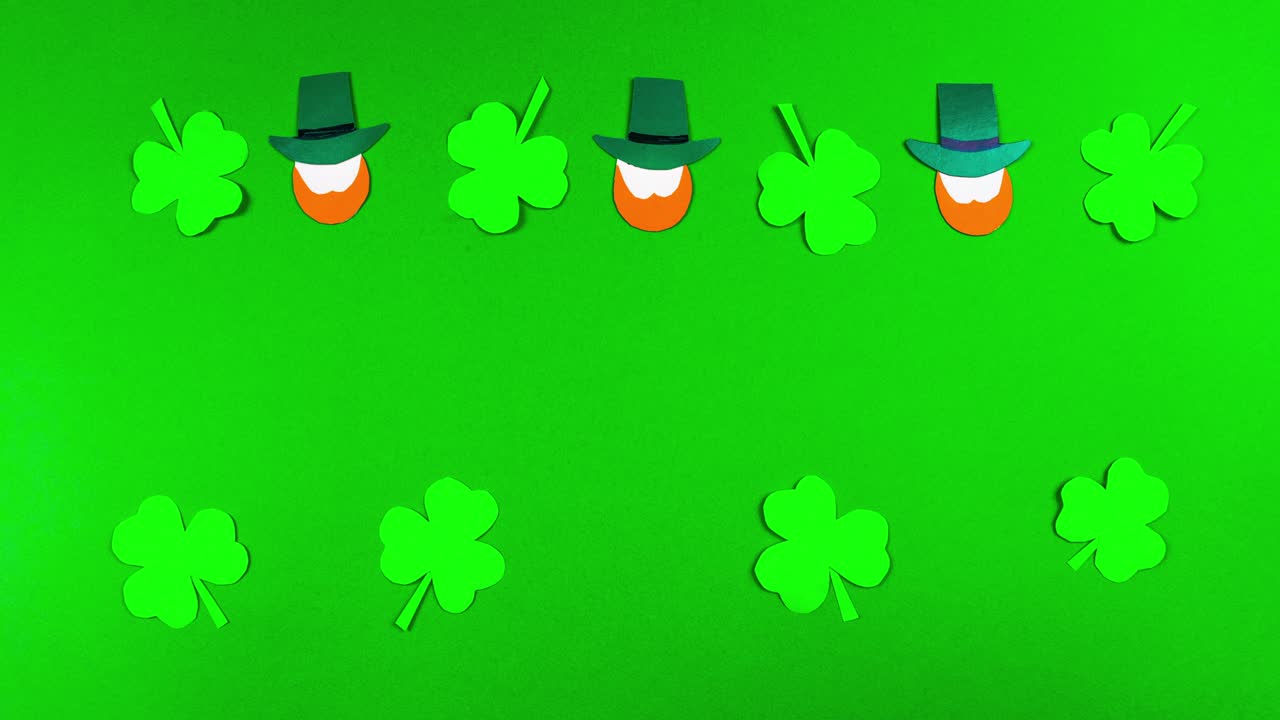 4k Greeting card for St. Patrick's Day, which is celebrated on March 17. Irish cultural holiday. Symbols of feast a shamrocks and leprechauns. Green background.