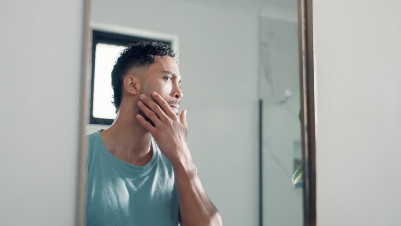 Man grooming in the mirror