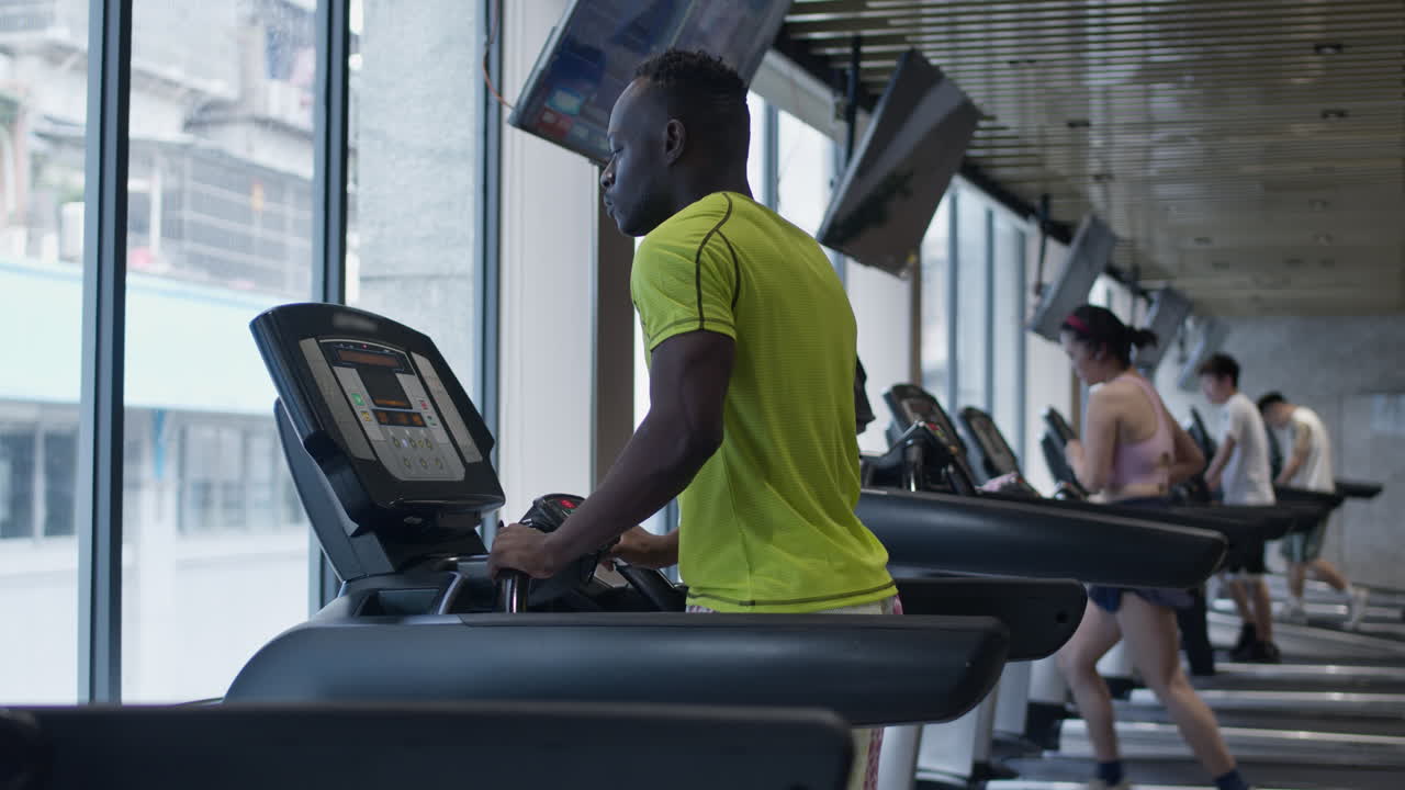 Man Working Out on Treadmill in Gym