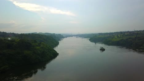 aerial view of the nile river flowing through rural landscape at sunrise in africa