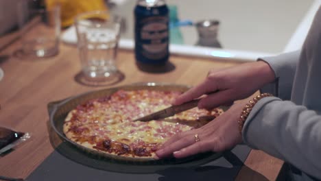 dinner made easy: close-up of frozen pizza cutting board