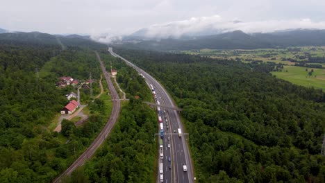 European-highway-with-overpass-and-power-lines-and-traffic-jam-on-one-side-of-the-national-road-due-to-heavy-traffic