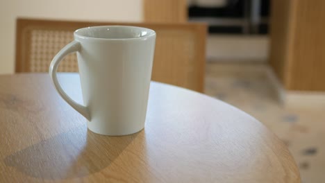 white mug on a wooden table