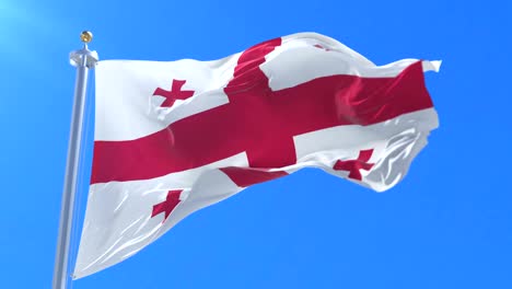 flag of georgia waving at wind in slow in blue sky, loop