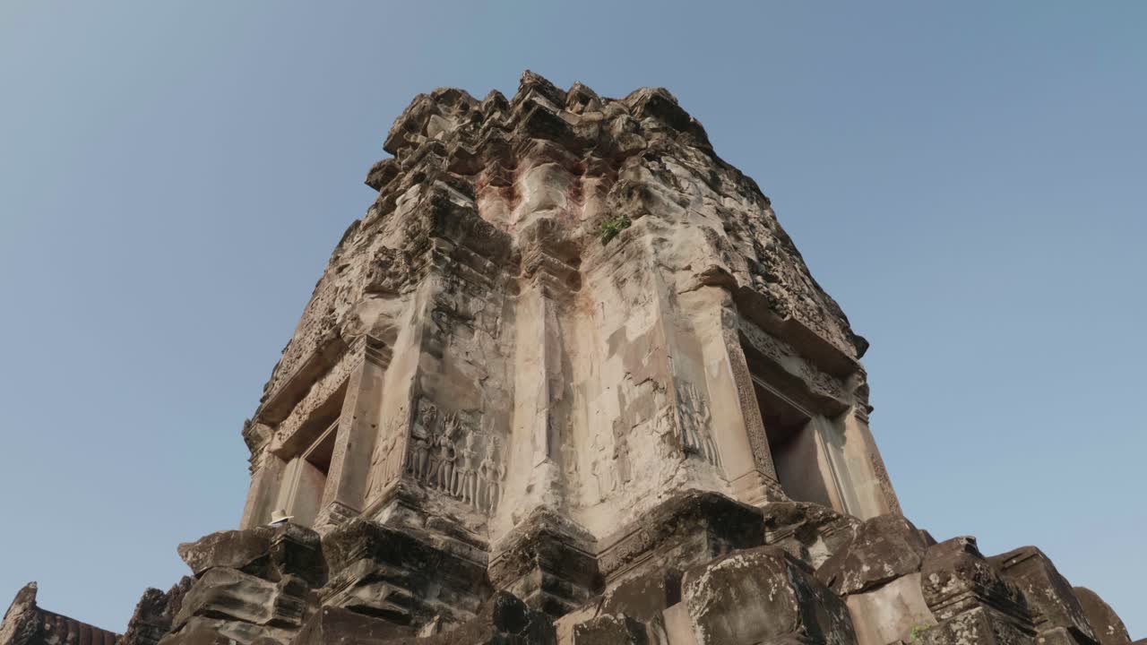 Tilting Up On A Building Inside The Courtyard Of Angkor Wat. 4K Slow Motion.