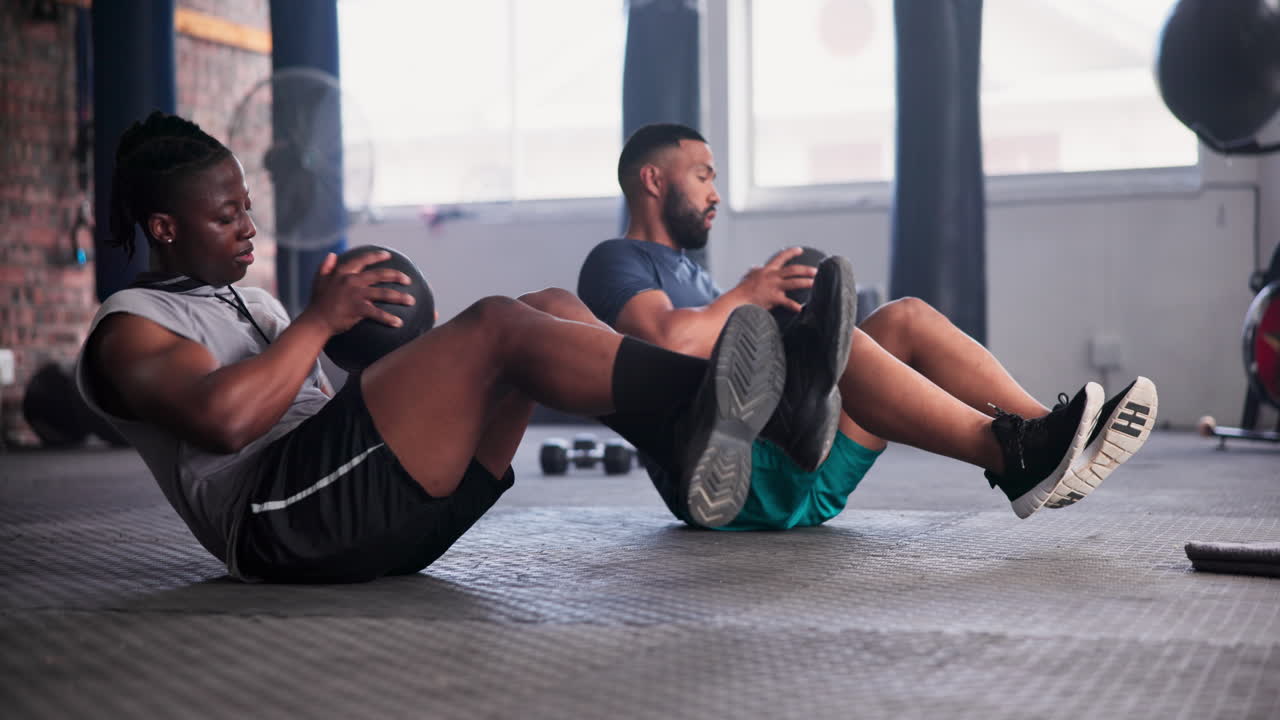 Two Men Doing Medicine Ball Exercises