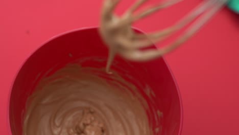 close-up of delicious home-made ice cream dripping from a whisk while mixing