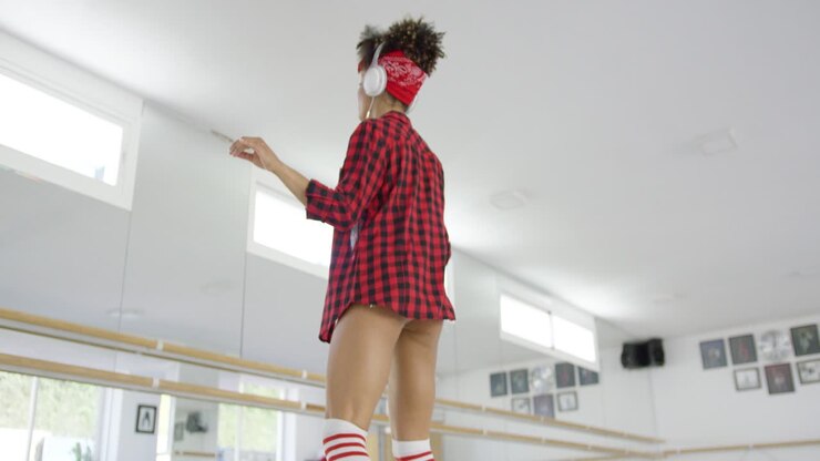 Low angle view of female dance student in shorts