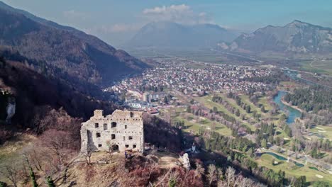 Aerial-Flying-Over-Ruins-of-Wartenstein-Castle-Overlooking-Bad-Ragaz-Valley-Landscape-With-River-Rhine-Running-Through-It