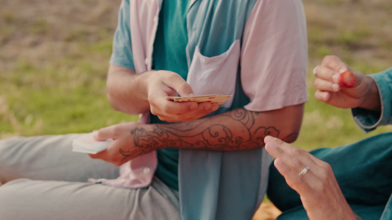 Friends Playing Cards at a Summer Picnic