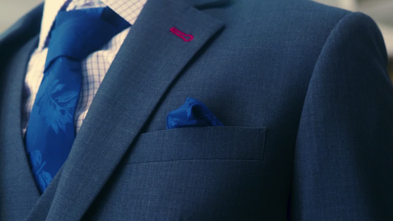 4K Cinematic fashion clothing footage of suits and ties in a tailor's shop