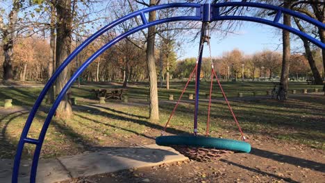 Rocking-vacant-web-swing-at-children-playground-in-4k