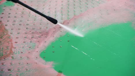 Slow-Motion-Video-4K-Closeup-Water-that-washes-high-pressure-ship-deck-floors-with-a-pressure-washer