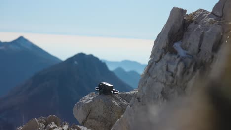 fpv drone taking off from mountain side ledge