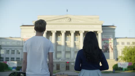 couple gazing at a majestic building