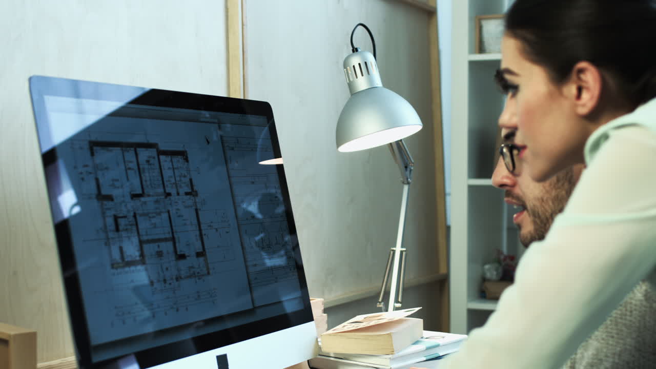 Small business team of architects working at night