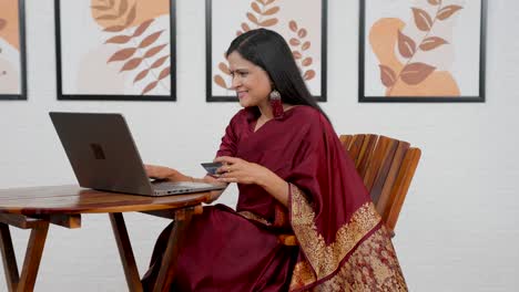 indian woman using debit card