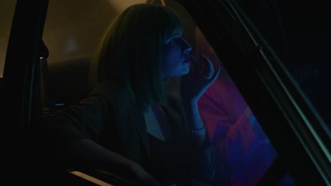 nighttime car ride with neon lights