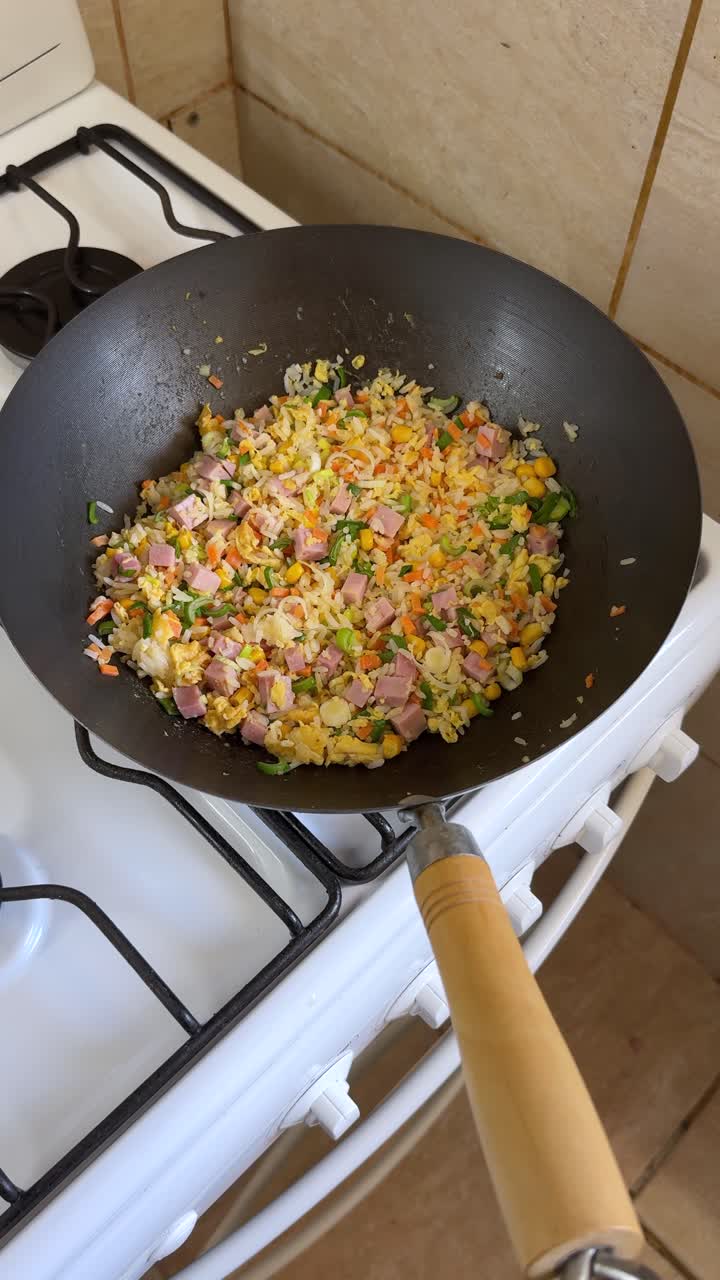 Vertical View Of A Cooked Chow Fan Rice In A Wok Pan. High Angle Shot