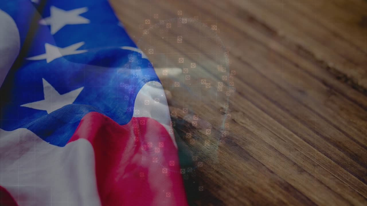 Opening close-up folded US flag rippling on tabletop pulsing data overlay visualizing market trends