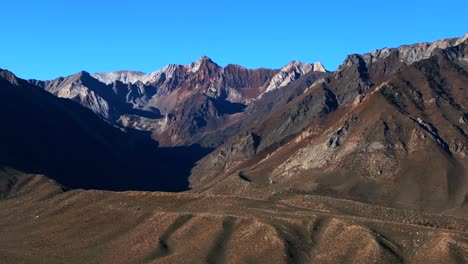 mount morrison morgan sierra nevadas range mammoth lakes crowley aerial drone california rugged mountains convict canyon pct trail bishop toms trail blue sky morning pan left motion