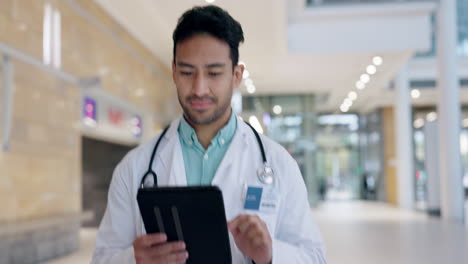 Tablet,-search-and-doctor-walking-in-a-hospital