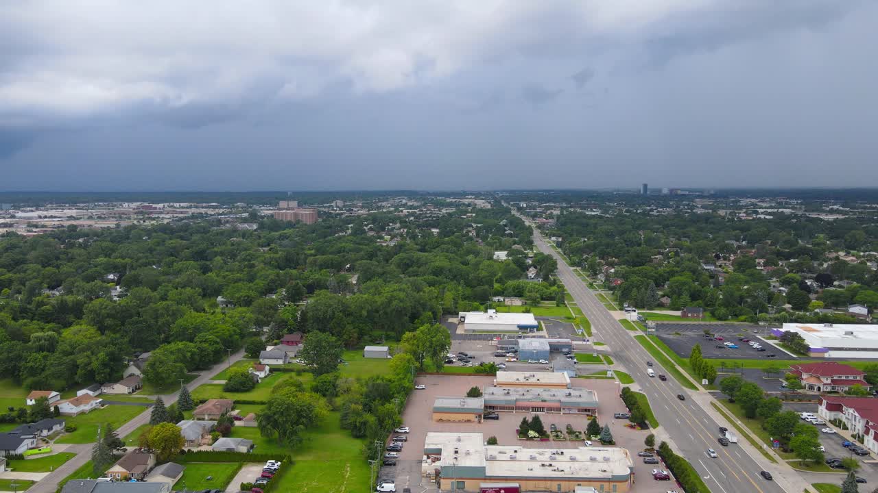 Iconic American township and massive clouds flowing above, aerial view