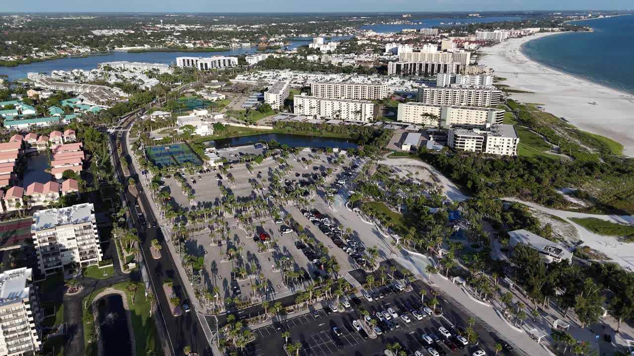 Siesta Key Beach on any given day, packed with locals and tourists basking in the summer sun