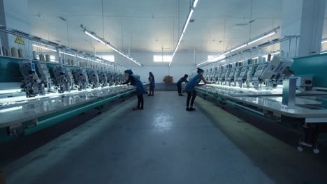 embroidery machines running fast at textile industry at garment manufacturers