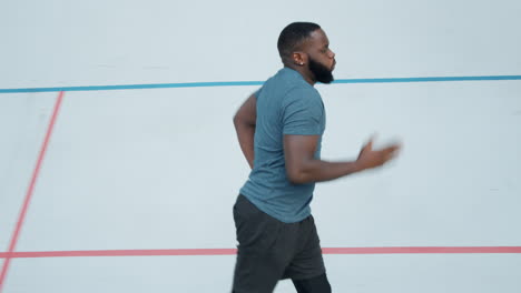 Man jogging on running track