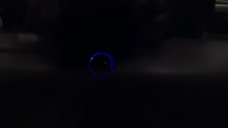 driving through a dark underground subway tunnel with futuristic blue glow