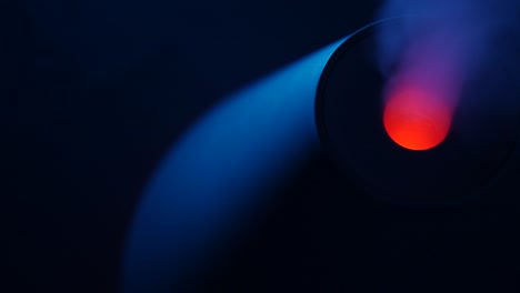 working a humidifier with a red circular light in the middle