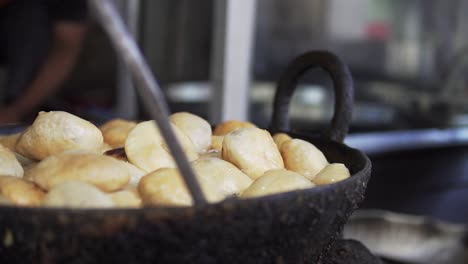 a delicious local street food, kachori being prepared in a local market in north india