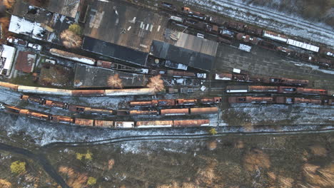 top down drone view of old and abandoned locomotive depot in the sunny day