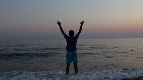 silhouette of sad depressed man on beach