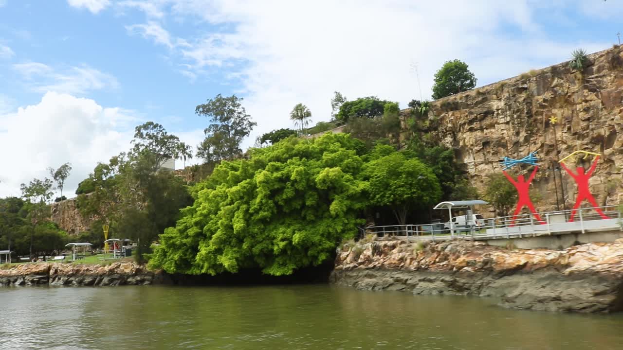 Tracking shot of Kangaroo Point Cliffs Park in Brisbane from the Brisbane River.