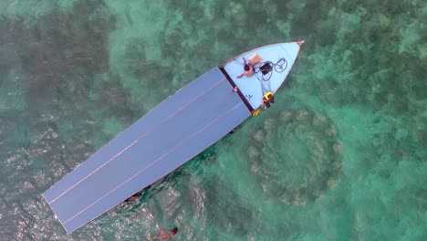 Top-view-of-tourist-boat-at-snorkeling-spot-at-Gili-Islands,-Lombok,-Indonesia