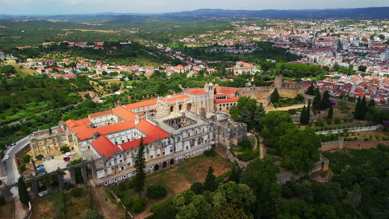 Drone orbit shows Convent of the Order of Christ and castle above Tomar, Santarém, Portugal