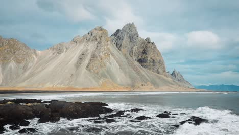 mountains-and-ocean-waves-on-the-coast-of-Iceland-beach