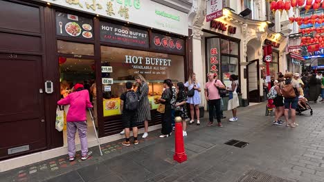 people walking and interacting in chinatown